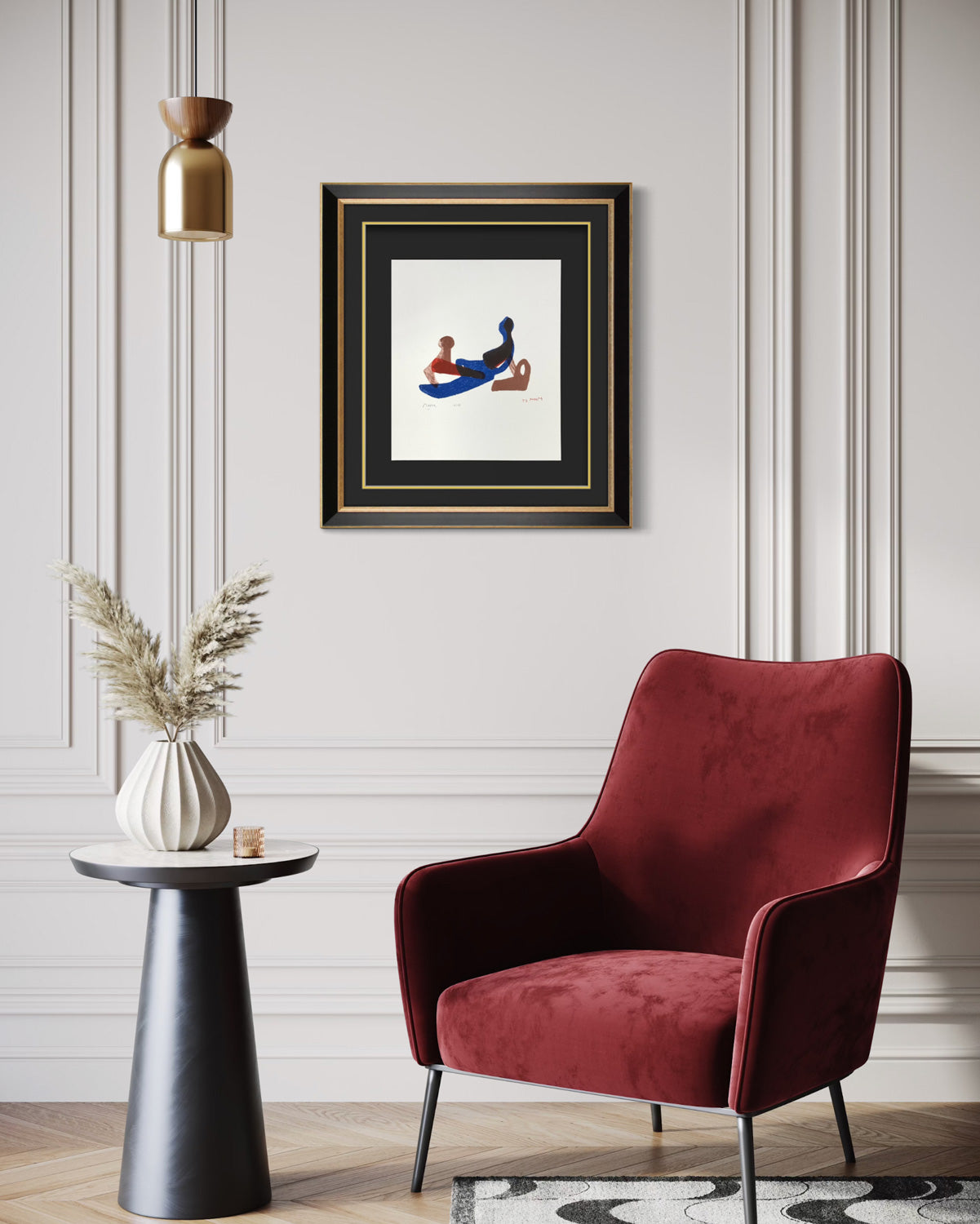 Red armchair in a stylish room with a hand signed Henry Moore artwork on the wall.
