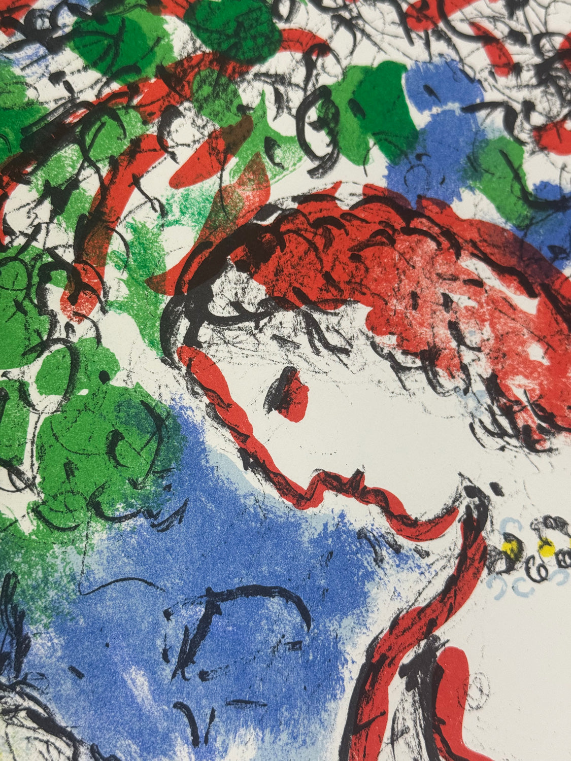 A close-up of an abstract artwork Chagall piece featuring a stylized face with red hair, blue clothing, and green foliage on a white background, rendered in expressive black lines and textured color blocks.
