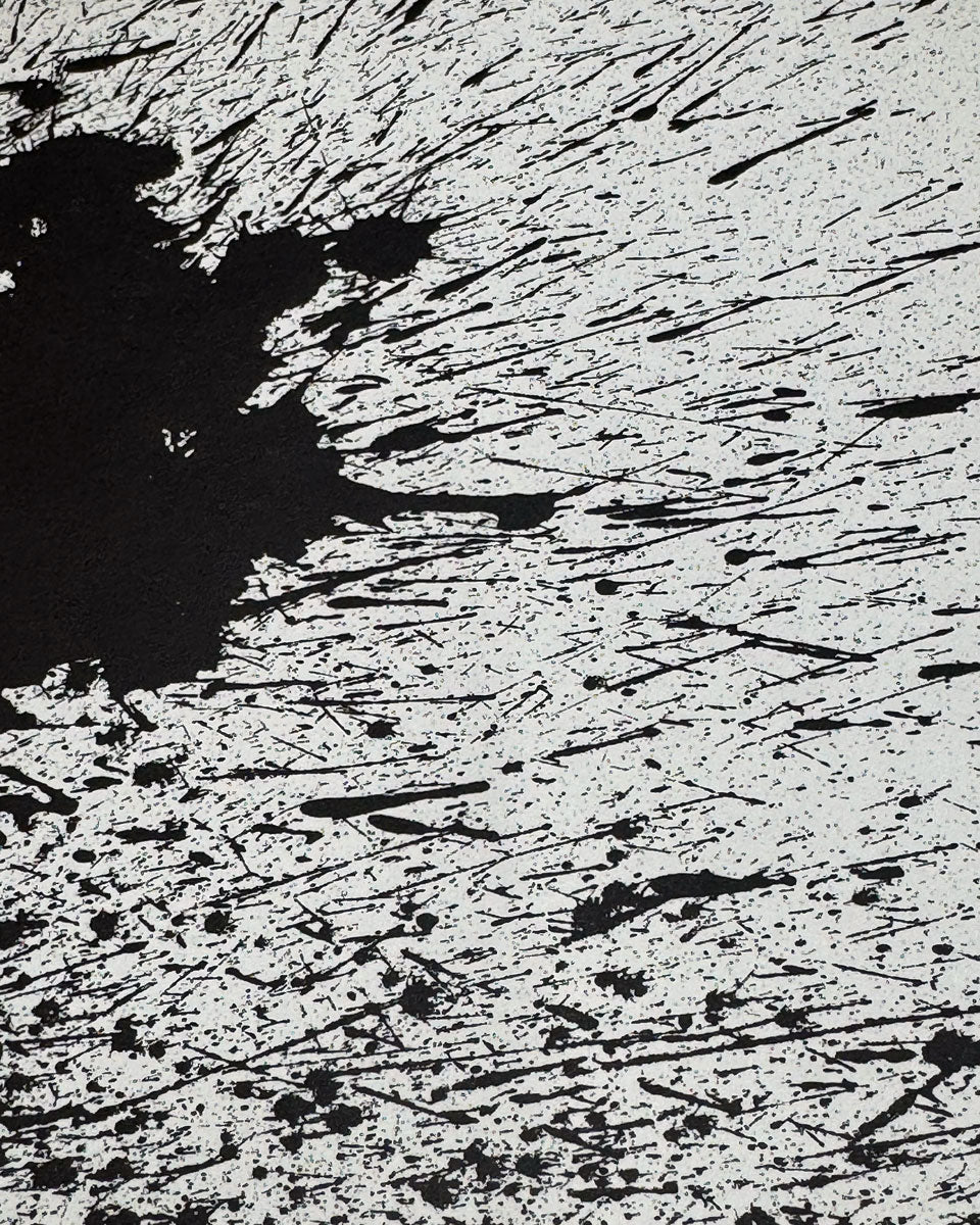 Closeup Miro Lithograph of a Black ink splatter and brushstroke pattern on a white textured background.