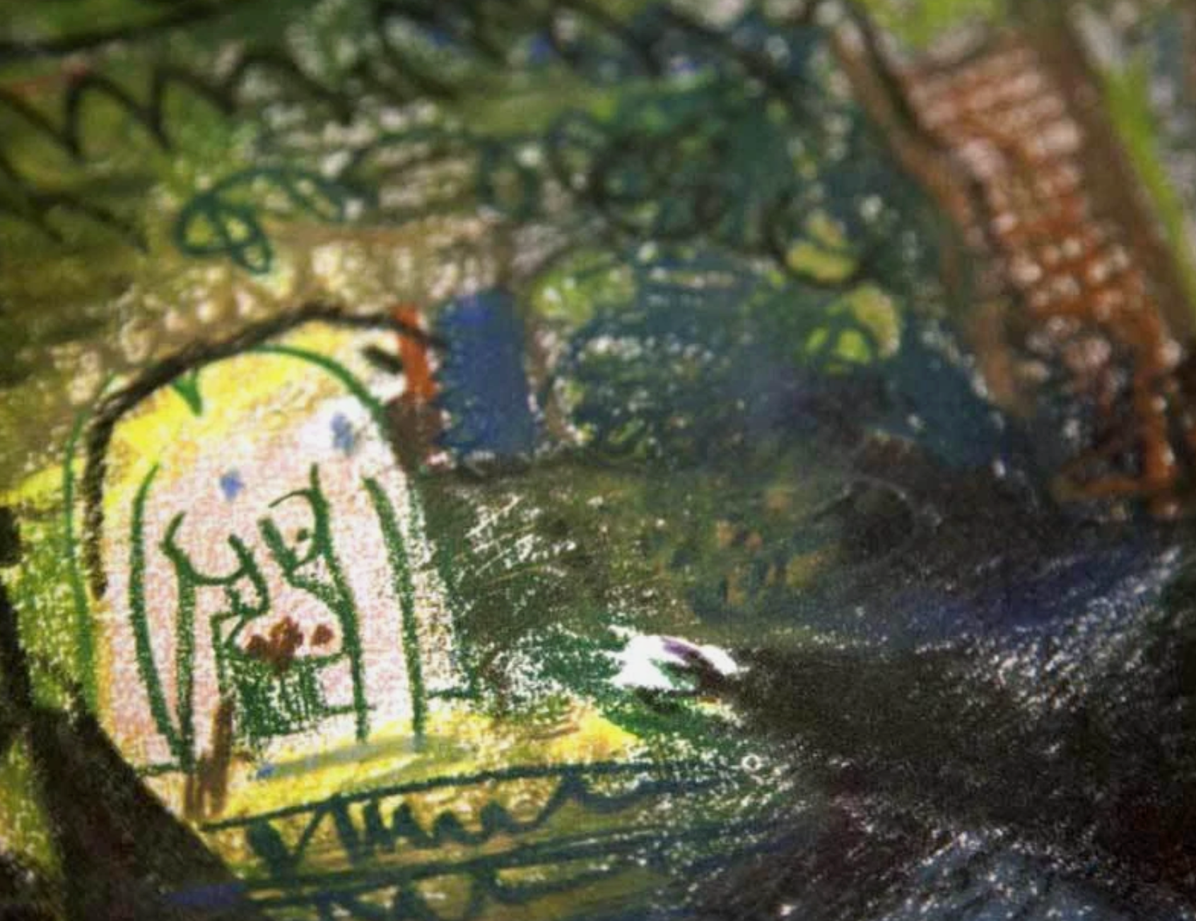 Close-up of a textured surface with Pablo Picasso elements and a signature.