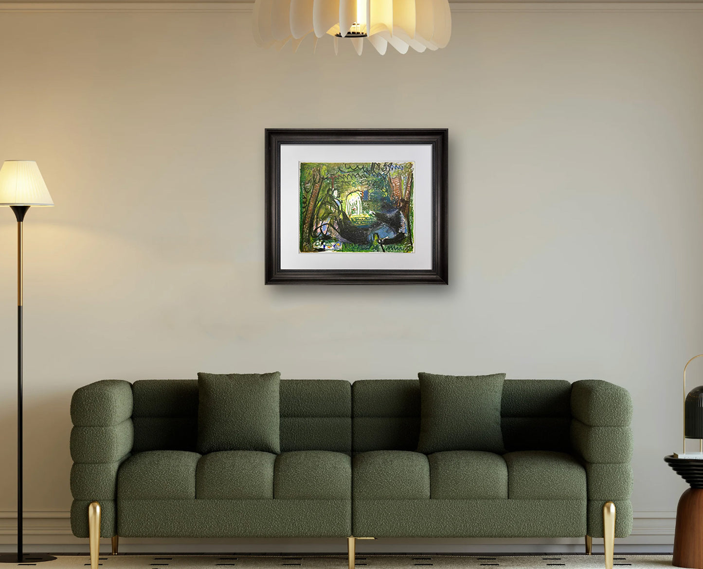 Green sofa in a living room with a framed  Pablo Picasso Lithograph on the wall.