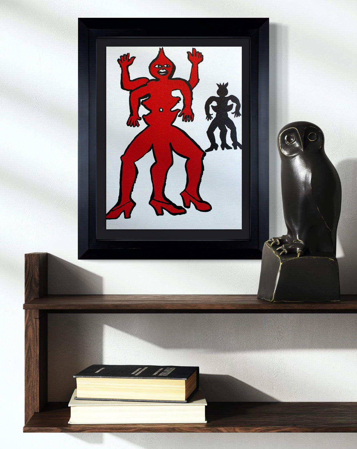 Framed Calder Lithograph of a red figure on a shelf with books and a black sculpture.