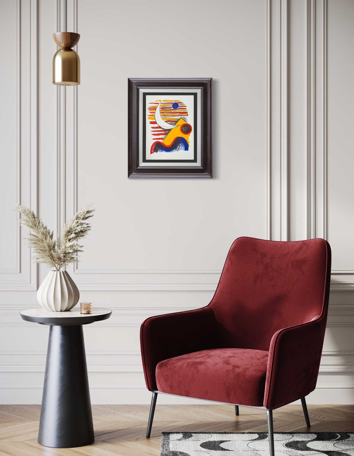 Red armchair in a room with a colorful abstract Alexander Calder Lithograph on the wall.